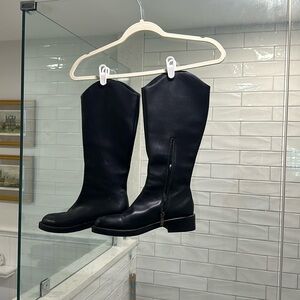 100% black leather boots, got them at a boutique.